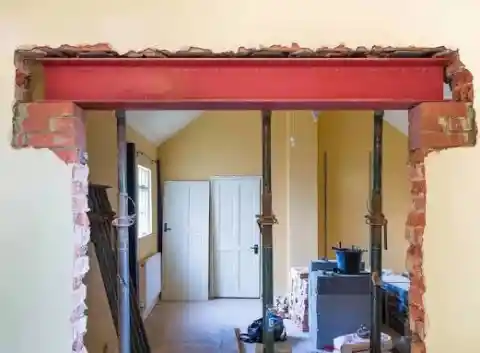 Load bearing wall removal showing RSJ steel beam installation in UK home renovation